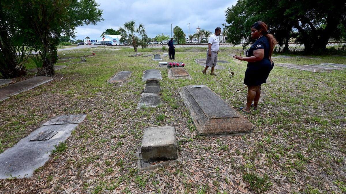 The Old Memphis Cemetery in Palmetto was the target of apparent vandals who smashed graves, headstones and spray-painted. Several people were walking through the graves to see if their loved ones’ graves were damaged. Photos taken on May 12, 2026.